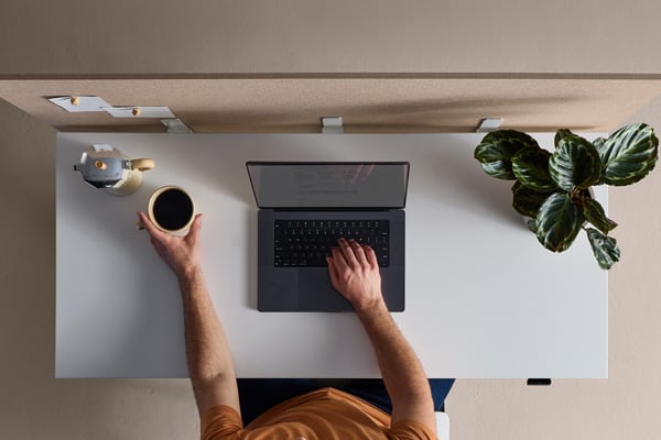 Person using laptop and phone