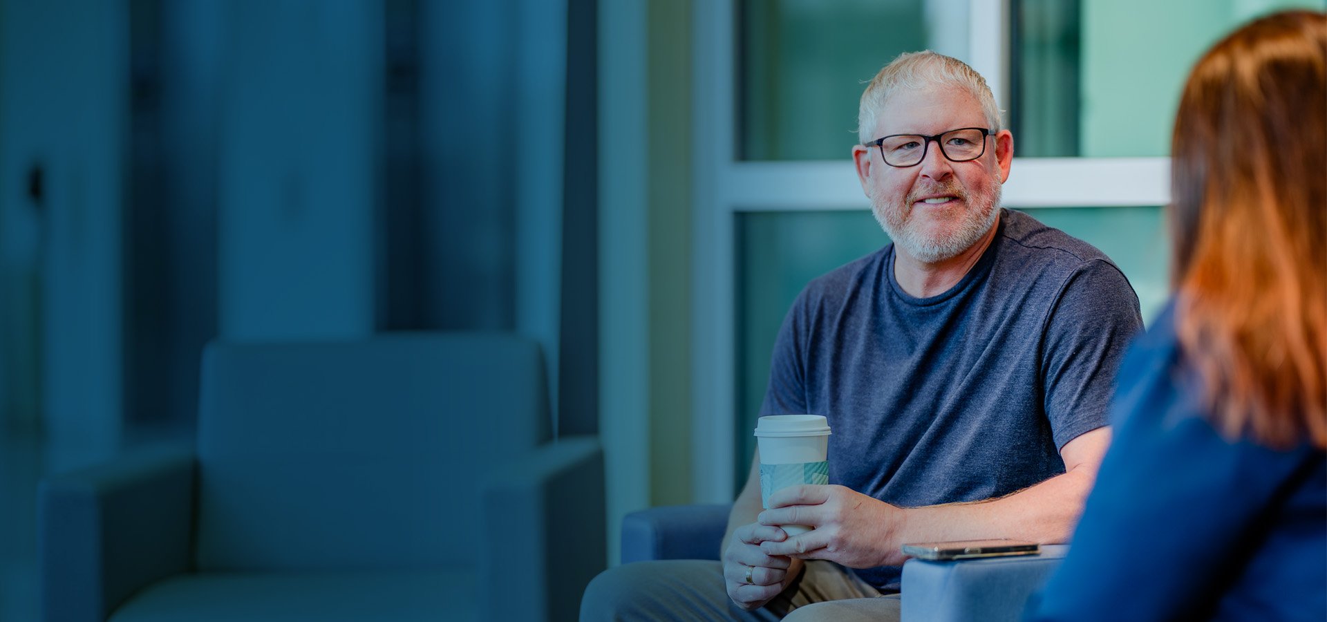 Background image with man in healthcare common area