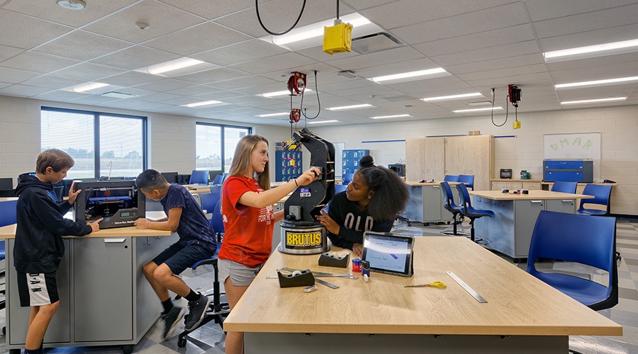 https://www.ki.com/globalassets/4.-insights/2.-blog/2020/02-2020/2-18-play-make-design-the-foundation-of-makerspaces-in-education/hilliardms_makerspace2_students_ruckusworktables_donitstools_900x500.jpg